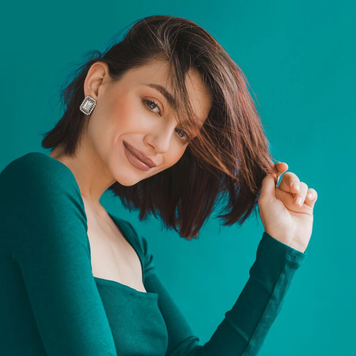 Model smiling at the camera.