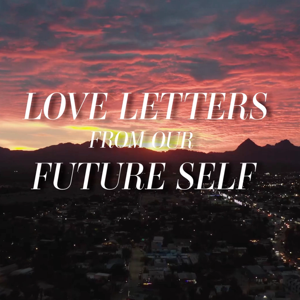 Love letters from our future self over background with a sunset.